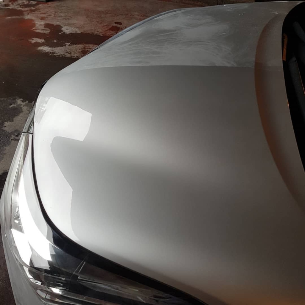 Multi-stage machine polishing as part of a proper paint revival service for a car in Co. Roscommon.