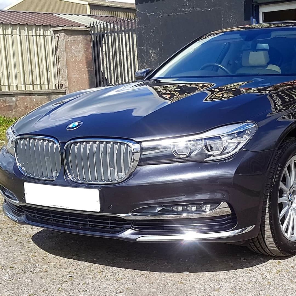 Car paint protection Roscommon showing how the liquid glass finish provides a long-term paint preservation and stunning gloss on a freshly coated car bonnet.