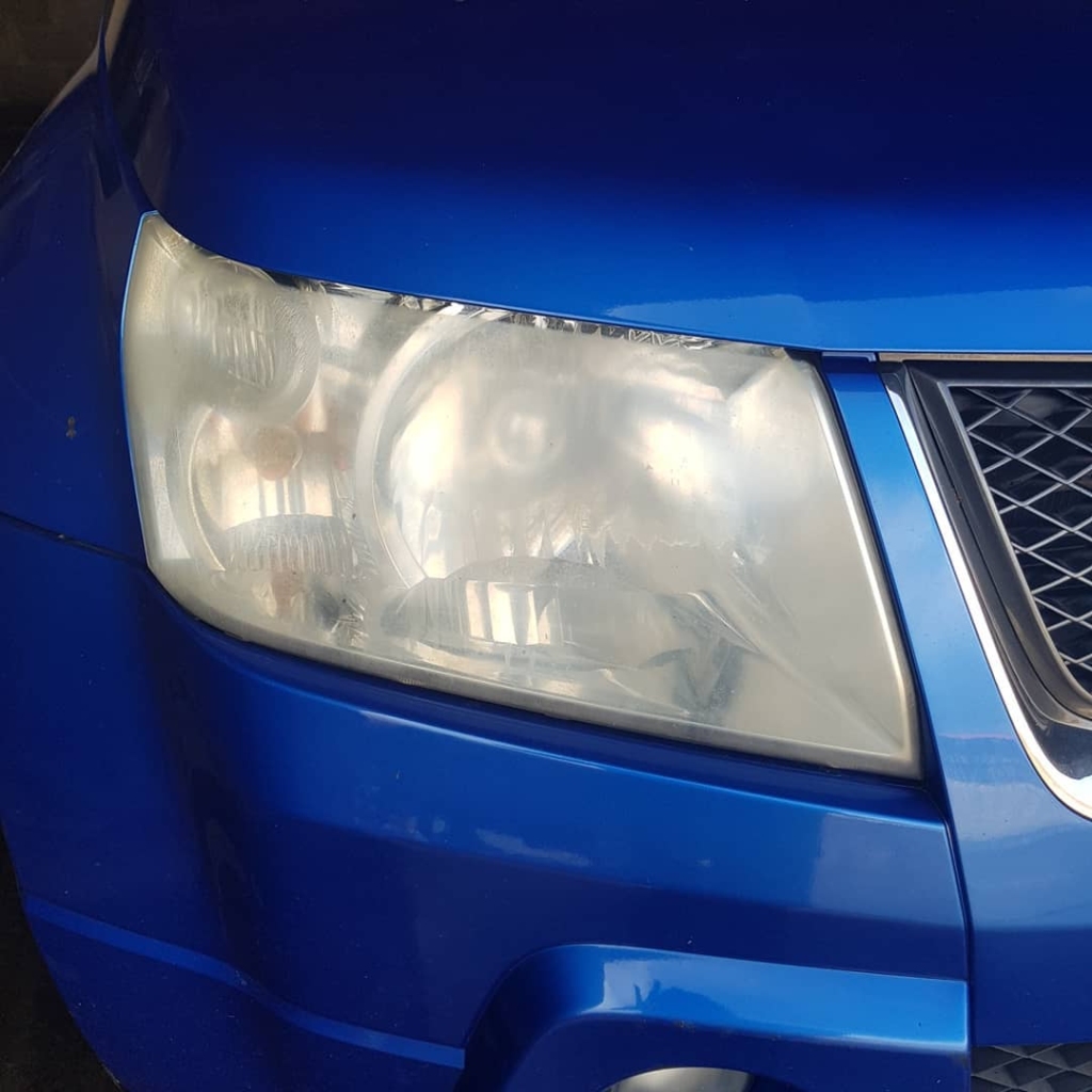 Removing heavy oxidation and yellowing from a foggy headlight lens in our Roscommon detailing workshop.