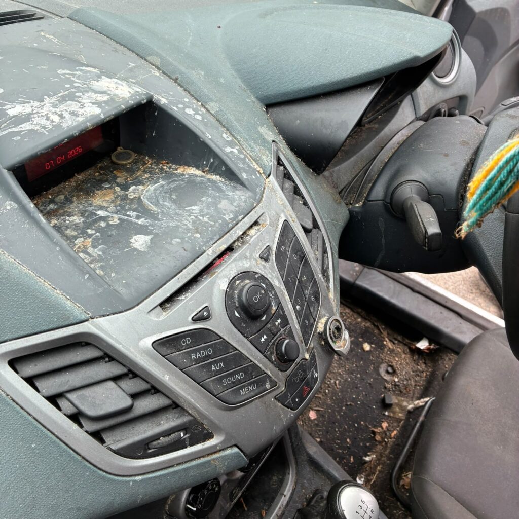 Dust and grime accumulated across a Kildimo car dashboard and center console before a Full Valet in Kilcornan.