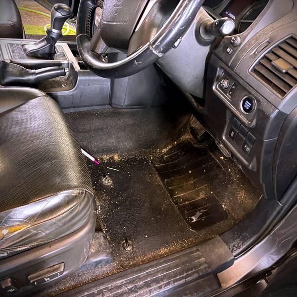 Pre-valet view of a dust-covered center console and dirty footwells at AG Valeting & Detailing serving Askeaton and Kildimo.
