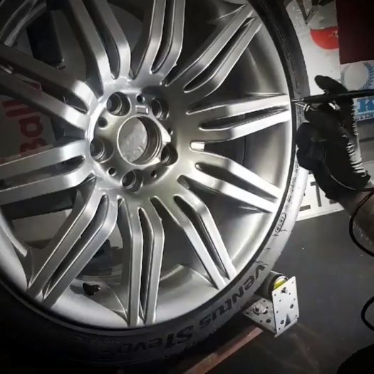 Applying specialized 9H wheel ceramic to prevent brake dust buildup, a must-have service for car enthusiasts near Dunshaughlin, Navan, Ashbourne, Meath & Dublin.
