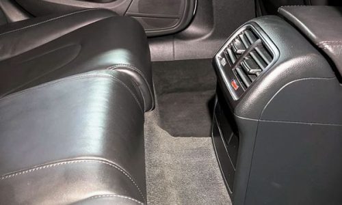 A quick vacuum and light surface dust-wipe of the rear leather seats to maintain a fresh, grit-free cabin layout between major details.