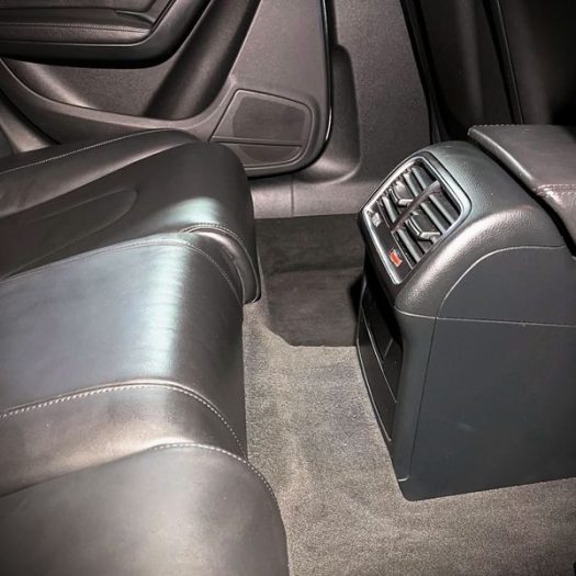 A quick vacuum and light surface dust-wipe of the rear leather seats to maintain a fresh, grit-free cabin layout between major details.