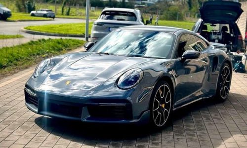 Cobalt coloured Porsche viewed from the front left perspective, protected by a 5-year ceramic coating.