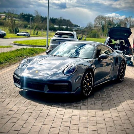 Cobalt coloured Porsche viewed from the front left perspective, protected by a 5-year ceramic coating.