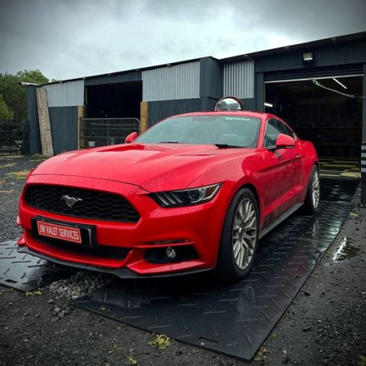 Front three-quarter perspective shot of a vehicle displaying deep paint depth and a rich clear coat shine for a Maynooth area customer.