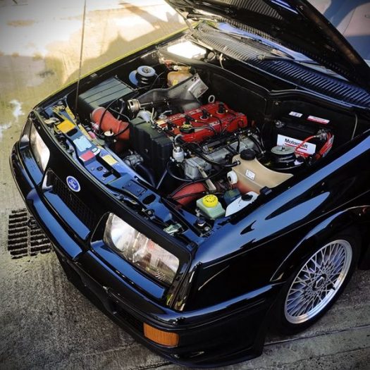 A black vintage car stunning gloss outside and under the bonnet after it got the Gold Car Detailing Pack in Dublin