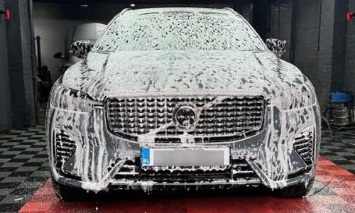 Professional hand-cleaning of a vehicle in Dublin to remove city grime.