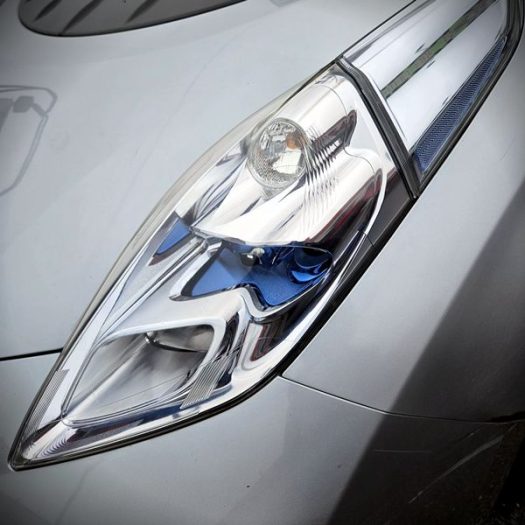 Machine polishing a hazy headlight lens with a compound pad to bring back optical clarity and a smooth finish after the sanding stages as part of Headlight restoration at Car Valet Hero Athlone, Quality Car Wash & Valet