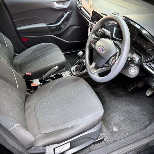 An overview of a valeted car front cabin, showing a dust-free dashboard and vacuumed seats and mats as part of Mini car valet at Car Valet Hero Athlone, Quality Car Wash & Valet
